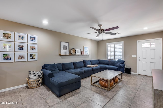 living room with tile patterned flooring and ceiling fan