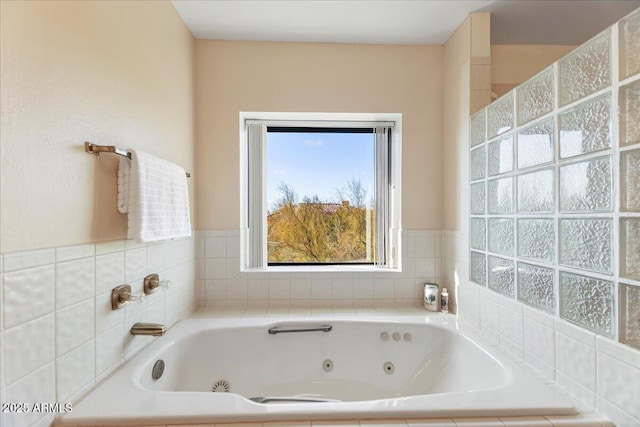 full bathroom with a whirlpool tub