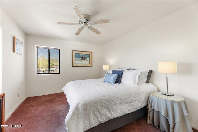 carpeted bedroom with baseboards and ceiling fan