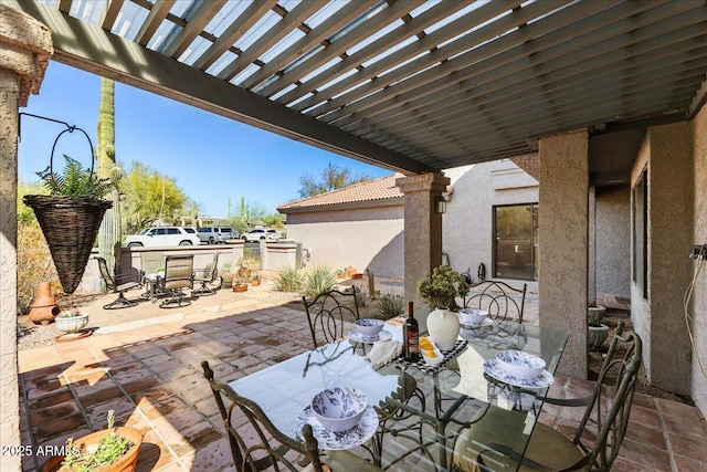 view of patio / terrace with outdoor dining area and a pergola