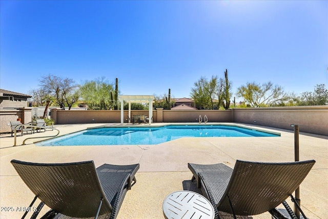 view of pool with a fenced in pool, fence, a pergola, and a patio area