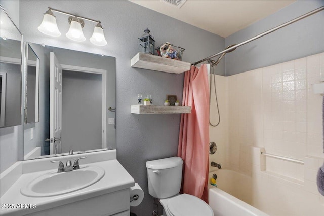 full bathroom featuring vanity, shower / tub combo, and toilet