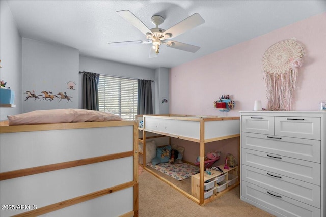 bedroom featuring light carpet and ceiling fan