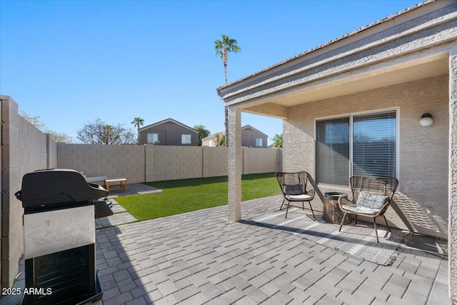 view of patio featuring a grill