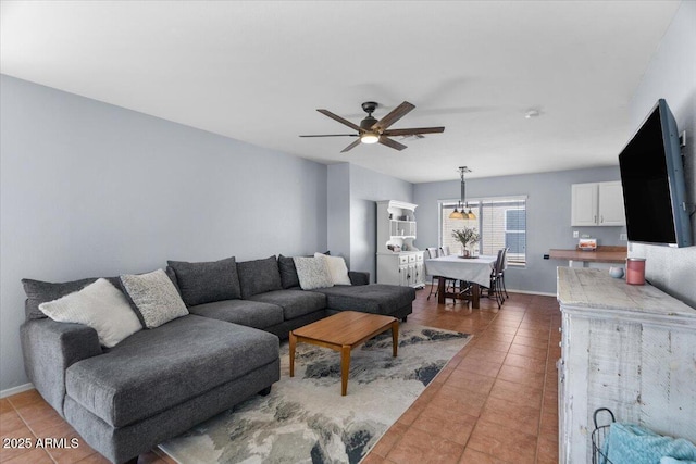 tiled living room with ceiling fan