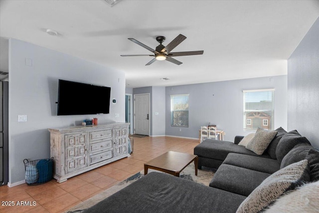 living room featuring ceiling fan and light tile patterned flooring