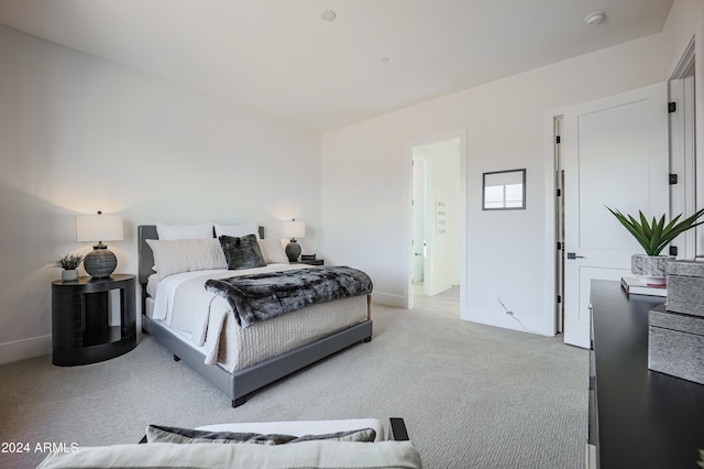 bedroom featuring light colored carpet