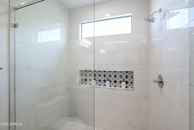 full bathroom featuring tiled shower