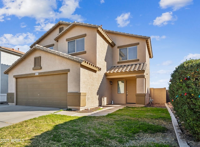 view of front of home featuring a garage and a front yard