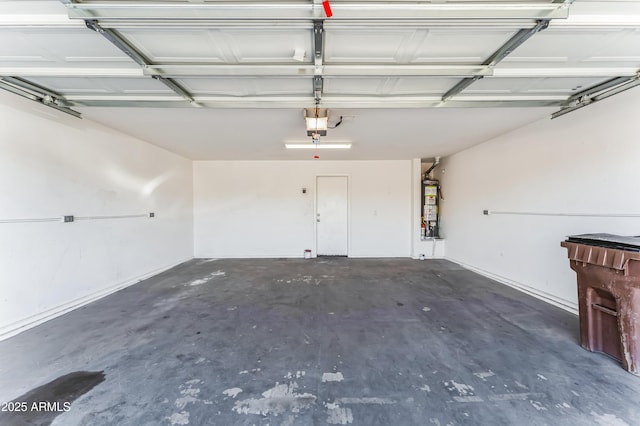 garage featuring a garage door opener and water heater