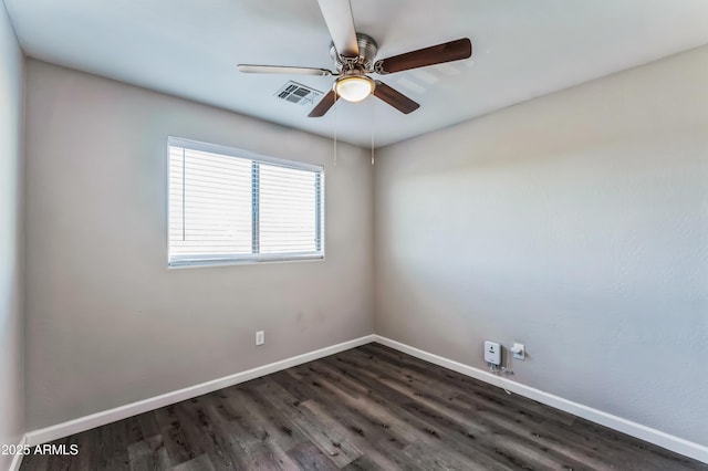 empty room featuring ceiling fan and dark hardwood / wood-style flooring