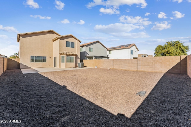 back of house with cooling unit and a patio area