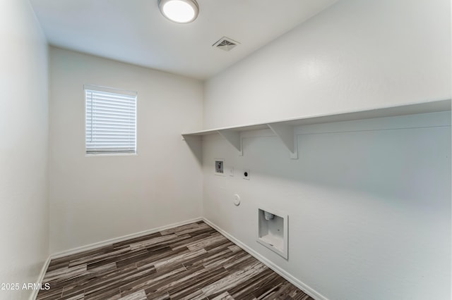 laundry area featuring washer hookup, dark hardwood / wood-style floors, gas dryer hookup, and electric dryer hookup