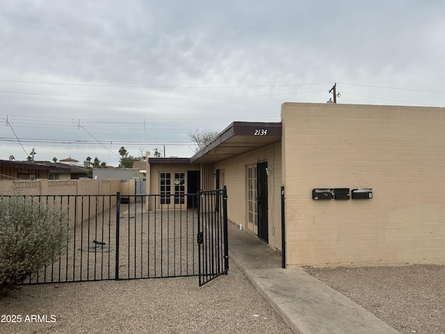 view of gate with fence