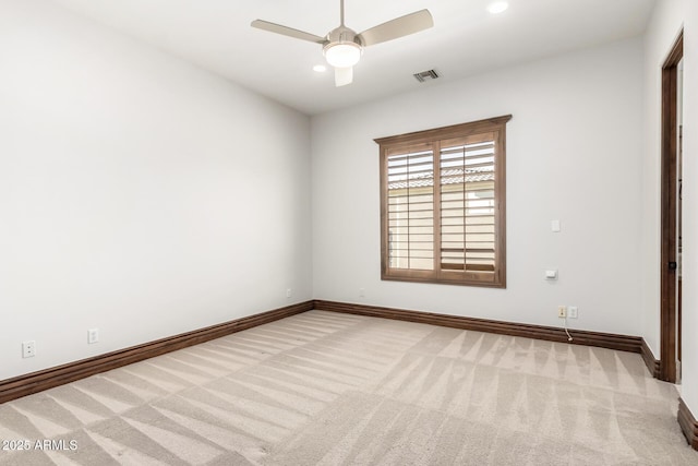 carpeted empty room featuring a ceiling fan, baseboards, visible vents, and recessed lighting