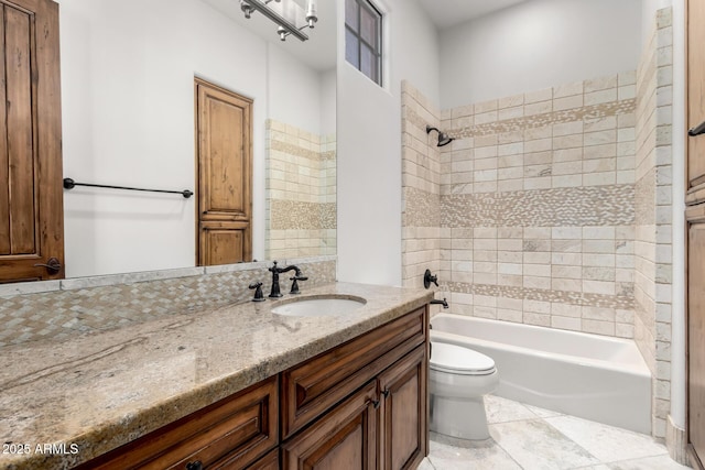full bath featuring vanity, tile patterned floors, shower / bathtub combination, and toilet