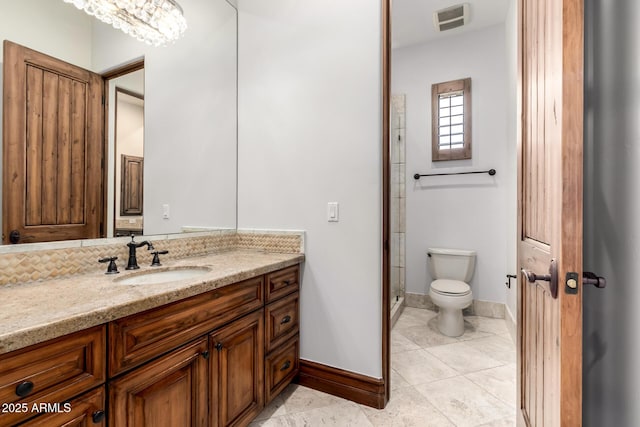 full bath with baseboards, vanity, toilet, and visible vents