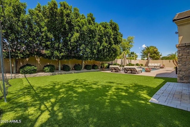 view of yard with a patio, outdoor lounge area, and a fenced backyard