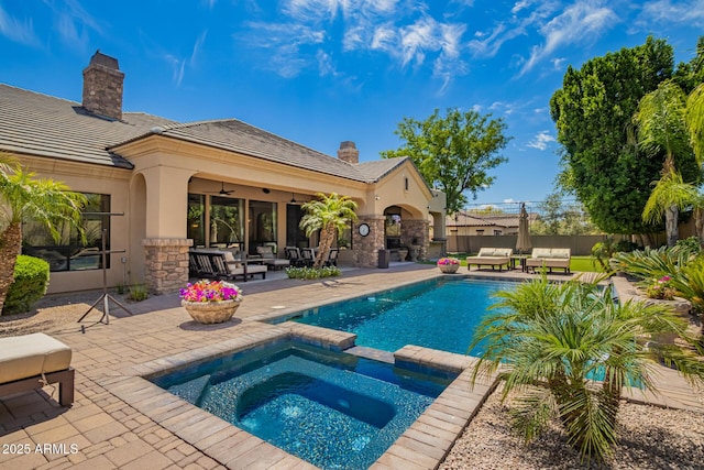 view of pool featuring a patio, ceiling fan, outdoor lounge area, and fence
