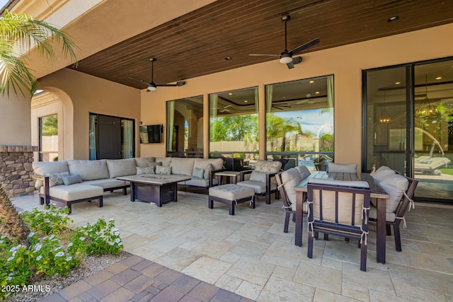 view of patio with outdoor lounge area and a ceiling fan