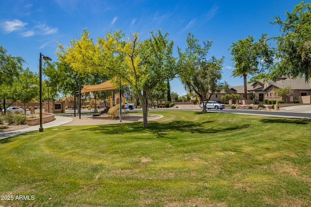 view of community featuring a lawn and playground community