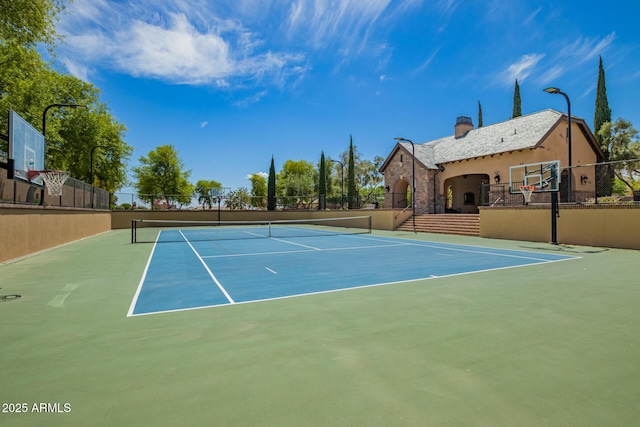 view of sport court featuring community basketball court and fence