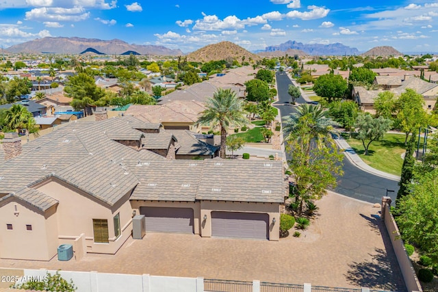 drone / aerial view featuring a residential view and a mountain view