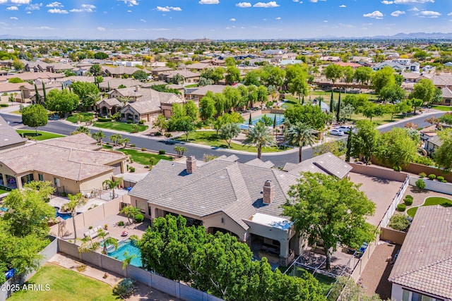 birds eye view of property with a residential view