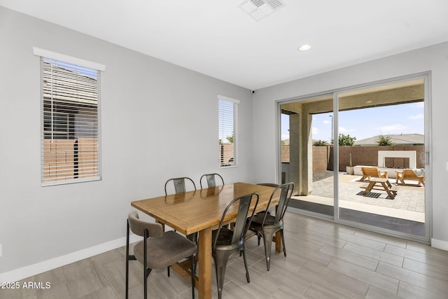 dining room with recessed lighting, light wood-style flooring, visible vents, and baseboards