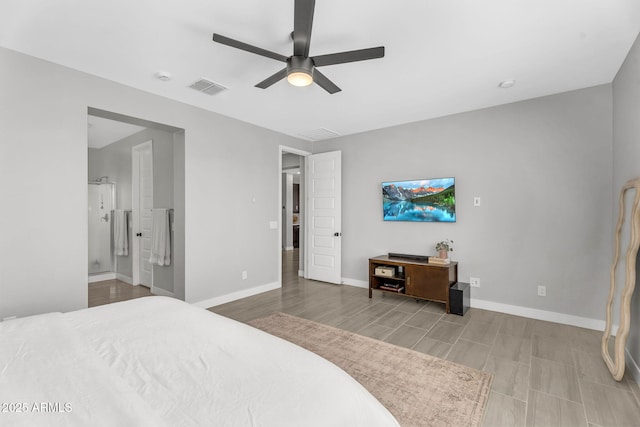bedroom with baseboards, visible vents, wood finished floors, ceiling fan, and connected bathroom