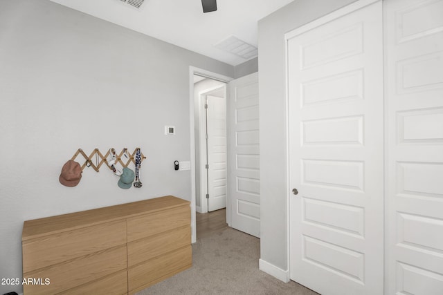 bedroom with a ceiling fan and light colored carpet