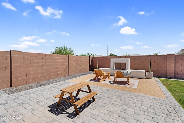 view of patio featuring a fenced backyard and outdoor dining area