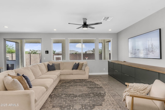 living area with recessed lighting, wood finished floors, visible vents, baseboards, and ceiling fan