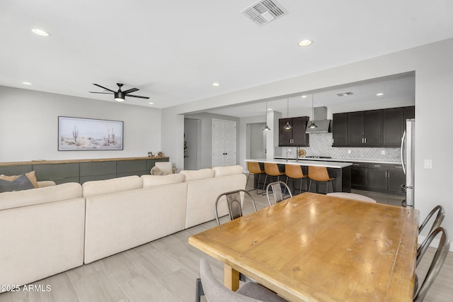 dining space with ceiling fan, visible vents, and recessed lighting