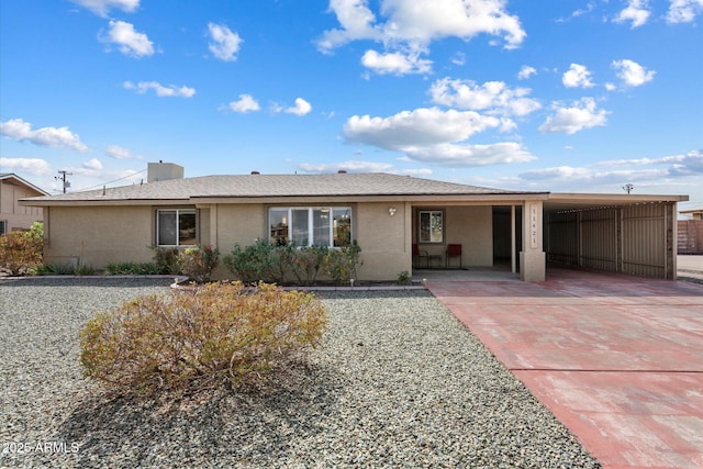 11421 W Lakeshore Dr, Youngtown, AZ 85363 - ranch-style house with an attached carport, concrete driveway, and stucco siding