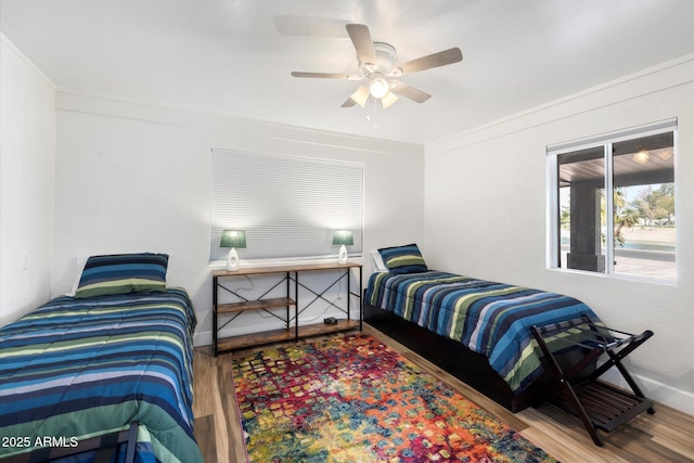 11421 W Lakeshore Dr, Youngtown, AZ 85363 - bedroom with a ceiling fan, wood finished floors, and crown molding