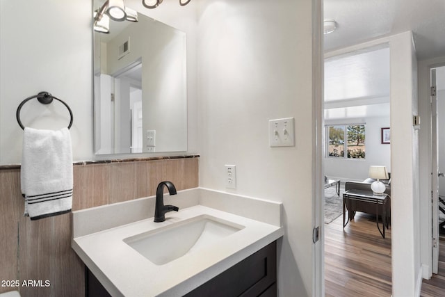 11421 W Lakeshore Dr, Youngtown, AZ 85363 - bathroom featuring visible vents, wood finished floors, and vanity