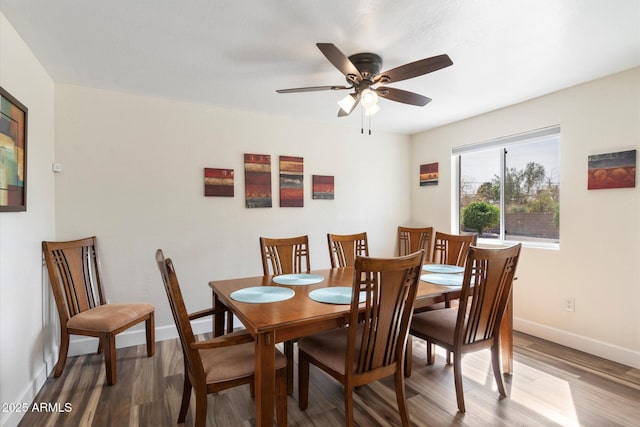 11421 W Lakeshore Dr, Youngtown, AZ 85363 - dining room featuring baseboards, ceiling fan, and wood finished floors