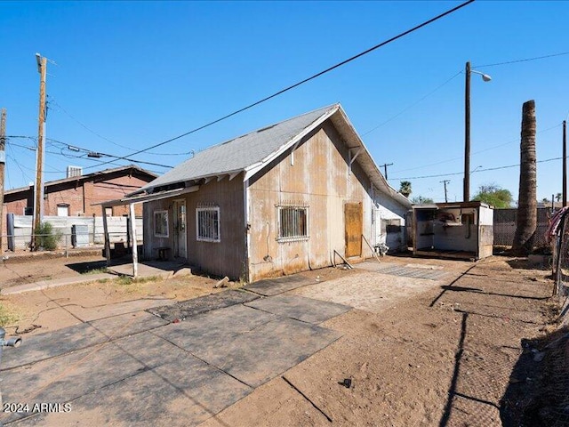 view of property exterior featuring a carport