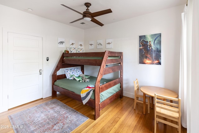 bedroom featuring hardwood / wood-style flooring and ceiling fan