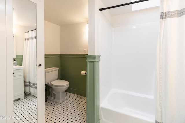 bathroom featuring toilet and vanity