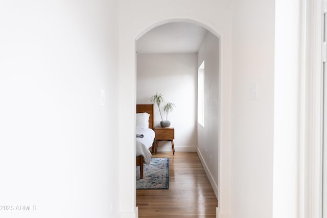 hall with hardwood / wood-style floors