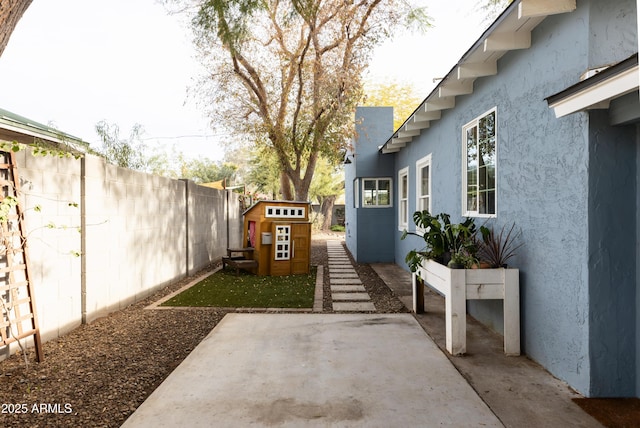 view of yard with a patio area and a shed