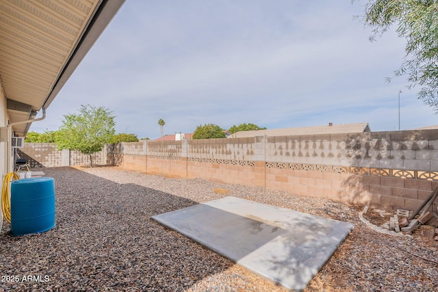 view of yard with a fenced backyard and a patio area