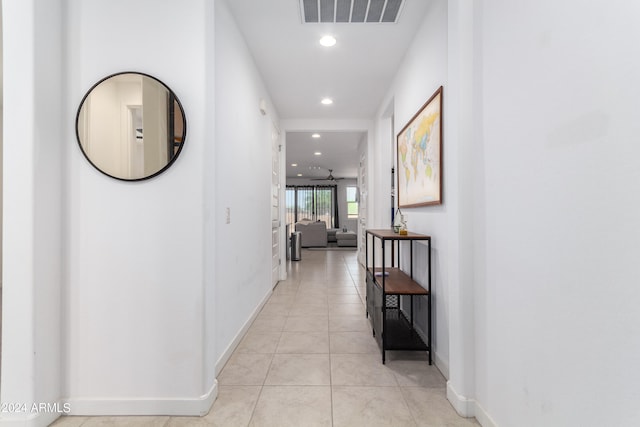 hallway featuring light tile patterned flooring