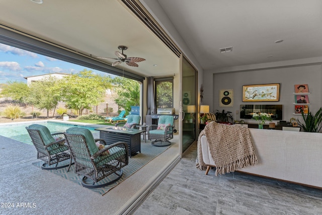 view of patio featuring ceiling fan and outdoor lounge area