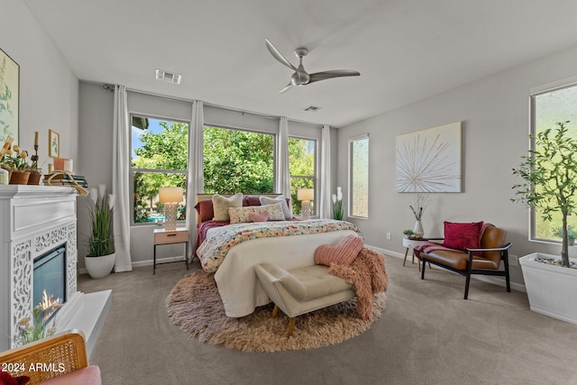 bedroom featuring ceiling fan and light carpet