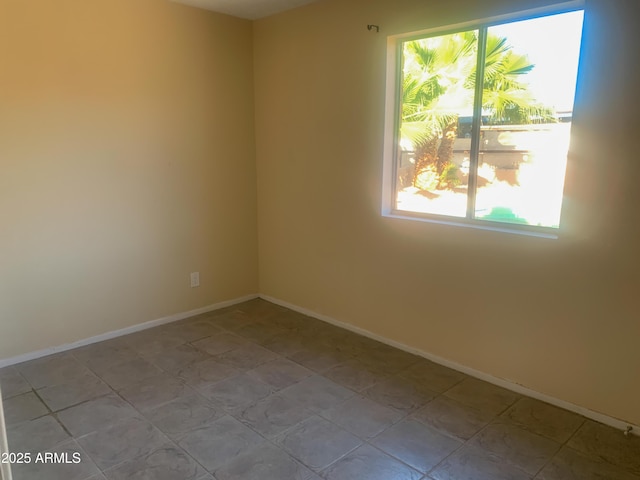 empty room with baseboards