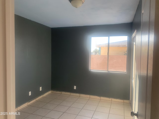 empty room with light tile patterned floors