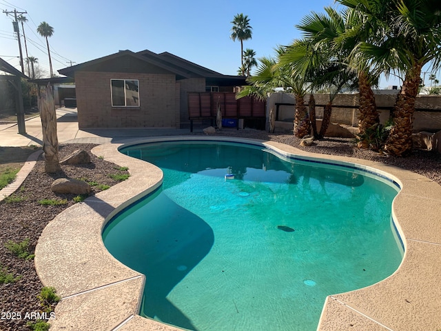 view of pool featuring a fenced in pool and a patio